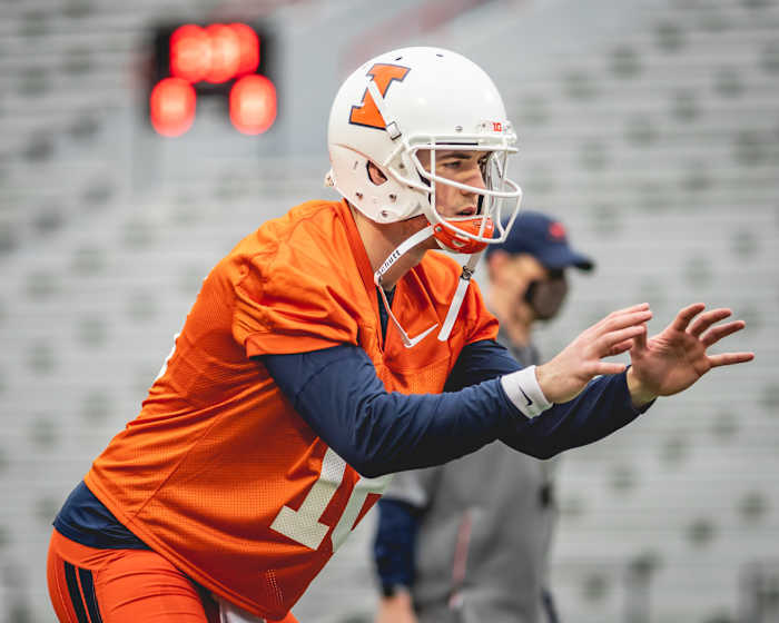 Illinois senior quarterback Brandon Peters taking a snap during the first spring practice on March 23, 2021.